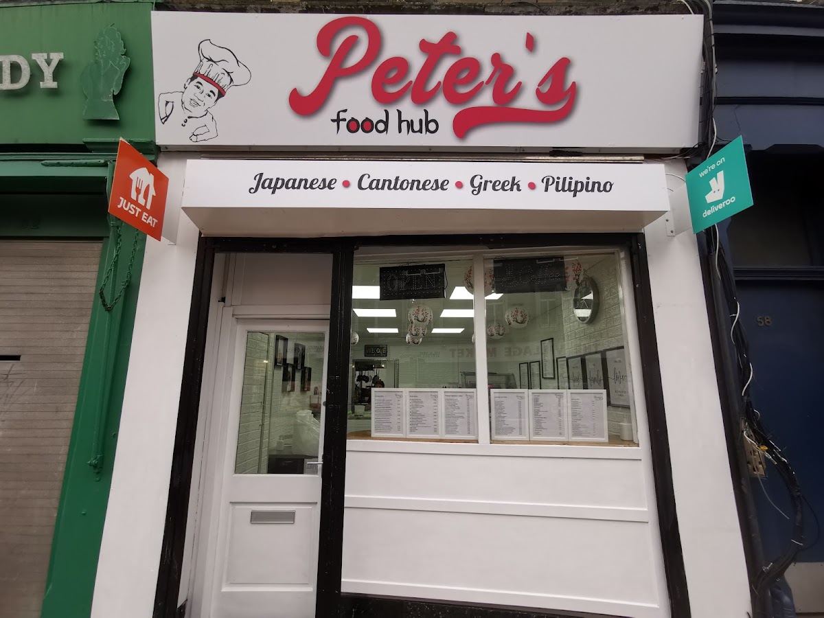 The Peter's Food Hub shopfront: white frontage, red Peter's sign, and the four cuisines written above the window