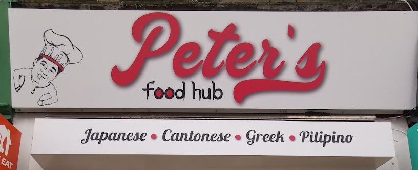 The Peter's Food Hub shop sign in red script, with 'Japanese, Cantonese, Greek, Pilipino' underneath